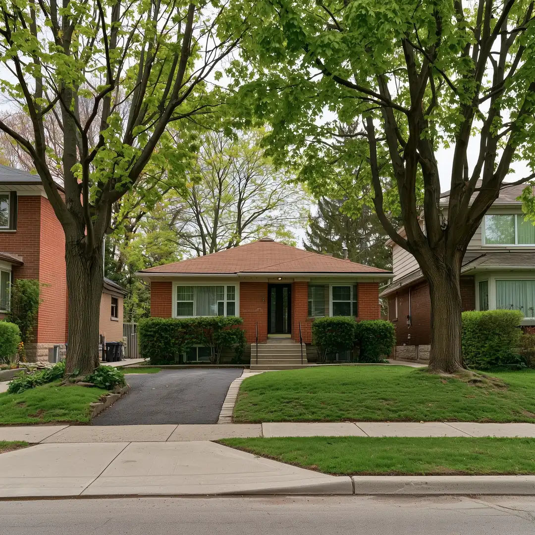 Older one-storey brick bungalow on a Toronto lot before it comes down for a custom home